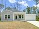 Charming one-story home with gray siding and a two-car garage at 17399 Masten Ave, Port Charlotte, FL 33954