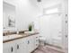 Clean bathroom, featuring a bathtub shower combo and white cabinets with wood countertops at 18078 Spartonvail Ave, Port Charlotte, FL 33954