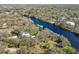 Aerial view showing a house near the river and surrounding landscape at 6605 N Boulevard, Tampa, FL 33604
