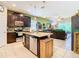 Modern kitchen with stainless steel appliances and an island at 29405 Cochiti Lake Dr, San Antonio, FL 33576