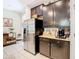 Spacious kitchen with ample counter space and dark wood cabinets at 29405 Cochiti Lake Dr, San Antonio, FL 33576
