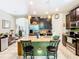 Kitchen features dark wood cabinets, granite counters and stainless steel appliances at 29405 Cochiti Lake Dr, San Antonio, FL 33576