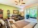 Comfortable living room with two reclining chairs and a ceiling fan at 29405 Cochiti Lake Dr, San Antonio, FL 33576