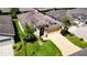 One-story house with tan exterior, attached garage, and landscaped lawn at 29405 Cochiti Lake Dr, San Antonio, FL 33576
