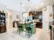 Bright kitchen boasts an island, stainless steel appliances, and dark cabinetry at 29405 Cochiti Lake Dr, San Antonio, FL 33576