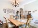 Spacious dining area with a large wooden table and wall art at 29405 Cochiti Lake Dr, San Antonio, FL 33576