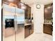 Well-equipped kitchen featuring stainless steel refrigerator and cabinetry at 29405 Cochiti Lake Dr, San Antonio, FL 33576