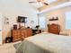 Large bedroom with ample built-in storage and a TV at 29405 Cochiti Lake Dr, San Antonio, FL 33576
