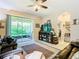 Relaxing living room with sliding glass doors leading to the backyard at 29405 Cochiti Lake Dr, San Antonio, FL 33576