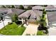 One-story house with tan exterior, attached garage, and landscaped lawn at 29405 Cochiti Lake Dr, San Antonio, FL 33576