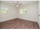 Bright bedroom with hardwood floors and ceiling fan at 4415 W Wisconsin Ave, Tampa, FL 33616