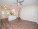 Bright living room with hardwood floors and ceiling fan at 4415 W Wisconsin Ave, Tampa, FL 33616