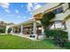 Exterior of the house with a covered patio and fountain at 7306 Pelican Island Dr, Tampa, FL 33634