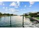 Picturesque waterfront view with private dock and lush landscaping at 7306 Pelican Island Dr, Tampa, FL 33634