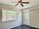 Dining room with tile floors, access to backyard, and ceiling fan at 3615 Wellington Dr, Holiday, FL 34691