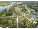 Aerial view of a lakefront community with numerous houses at 849 John Cressler Dr, Seffner, FL 33584