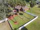 Large backyard with a white fence and several palm trees at 849 John Cressler Dr, Seffner, FL 33584