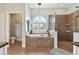 Luxurious bathroom featuring a large soaking tub and walk-in shower at 849 John Cressler Dr, Seffner, FL 33584