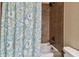 Bathroom with shower/tub combo and patterned shower curtain at 849 John Cressler Dr, Seffner, FL 33584