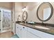Double vanity bathroom with granite countertops and large mirrors at 849 John Cressler Dr, Seffner, FL 33584