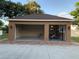 Attached two-car garage with epoxy flooring and lift at 849 John Cressler Dr, Seffner, FL 33584