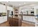 Bright kitchen boasts an island, stainless steel appliances, and ample cabinet space at 849 John Cressler Dr, Seffner, FL 33584