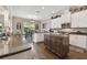 Spacious kitchen with island, granite countertops, and stainless steel appliances at 849 John Cressler Dr, Seffner, FL 33584