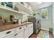 Bright laundry room with cabinets and shelving at 849 John Cressler Dr, Seffner, FL 33584