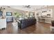 Comfortable living room with leather sofas and a view into the kitchen at 849 John Cressler Dr, Seffner, FL 33584