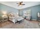 Serene main bedroom with a king-size bed and comfortable sitting area at 849 John Cressler Dr, Seffner, FL 33584