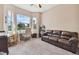 Bright home office with large window and comfortable seating at 849 John Cressler Dr, Seffner, FL 33584