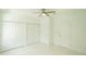 Well-lit bedroom with double door closet and white tile floors at 2603 S 70Th St, Tampa, FL 33619