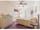 Bedroom with double bed, dresser, and ceiling fan at 37607 Neukom Ave, Zephyrhills, FL 33541