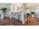 Kitchen with breakfast bar and view into dining area at 37607 Neukom Ave, Zephyrhills, FL 33541