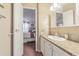 Second bathroom with a single vanity and access to bedroom at 37607 Neukom Ave, Zephyrhills, FL 33541