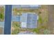 Aerial view showing a home's exterior and landscaping at 37607 Neukom Ave, Zephyrhills, FL 33541