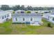 Aerial view of the house and surrounding homes at 37607 Neukom Ave, Zephyrhills, FL 33541