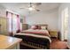 Bright bedroom with a queen-size bed and ample closet space at 37607 Neukom Ave, Zephyrhills, FL 33541