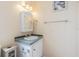 Small bathroom with vanity, medicine cabinet, and towel rack at 37607 Neukom Ave, Zephyrhills, FL 33541