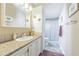 Clean bathroom with a single vanity and a walk-in shower at 37607 Neukom Ave, Zephyrhills, FL 33541