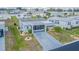 Aerial view of a single-wide mobile home and surrounding community at 37607 Neukom Ave, Zephyrhills, FL 33541