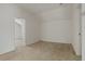 Spacious bedroom with carpeted floors and access to another room at 12814 Cattail Shore Ln, Riverview, FL 33579