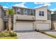 Modern two-story townhouse with a two-car garage and landscaped front at 3484 Timber Crossing Ave, Brandon, FL 33511