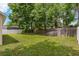Large backyard with grassy area and privacy fence at 12814 Cattail Shore Ln, Riverview, FL 33579