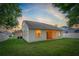 House exterior view with a large backyard and partial view of the neighborhood at 12814 Cattail Shore Ln, Riverview, FL 33579