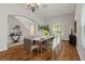 Formal dining room featuring a table set for six and hardwood floors at 12814 Cattail Shore Ln, Riverview, FL 33579
