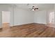 Bright living room with wood-look floors and access to other rooms at 12814 Cattail Shore Ln, Riverview, FL 33579