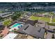 Bird's eye view of community amenities including a pool, recreation fields, and well-maintained landscaping at 1007 Emerald Dunes Dr, Sun City Center, FL 33573