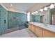 Modern bathroom with a walk-in shower featuring decorative tile and dual sink vanity at 1007 Emerald Dunes Dr, Sun City Center, FL 33573