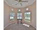 Bedroom with neutral walls and multiple windows to let in natural light at 1007 Emerald Dunes Dr, Sun City Center, FL 33573